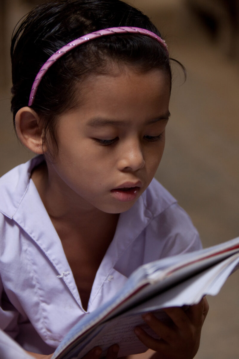 Student in a Refugee Camp — Karen people from Myanmar (Burma) have spent years in in refugee camps along the Thai/Burma border, to avoid violence from the mi...
