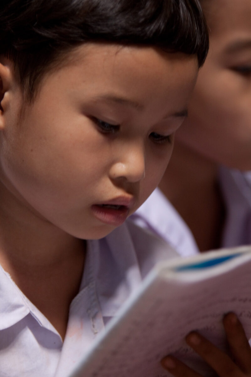 Student in a Refugee Camp — Karen people from Myanmar (Burma) have spent years in in refugee camps along the Thai/Burma border, to avoid violence from the mi...