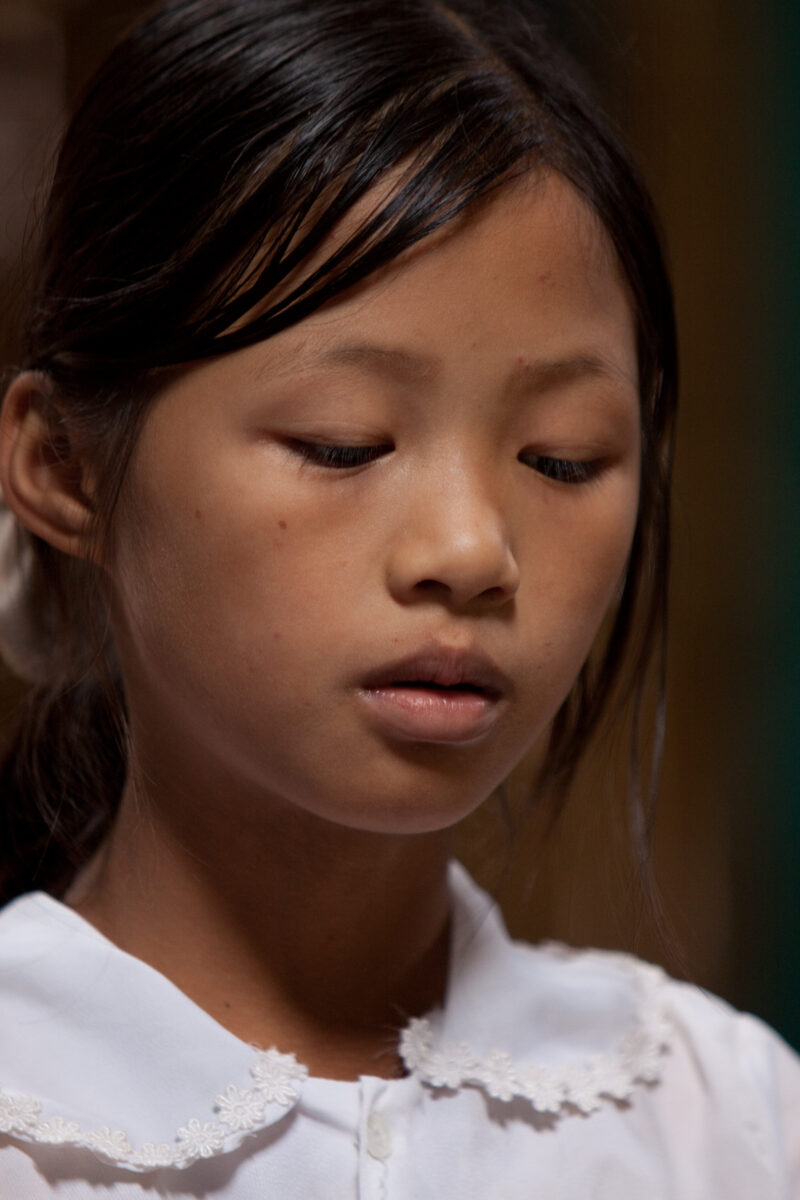 Student in a Refugee Camp — Karen people from Myanmar (Burma) have spent years in in refugee camps along the Thai/Burma border, to avoid violence from the mi...