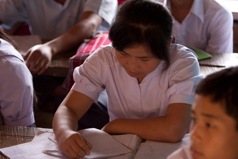 Student in a Refugee Camp — Karen people from Myanmar (Burma) have spent years in in refugee camps along the Thai/Burma border, to avoid violence from the mi...
