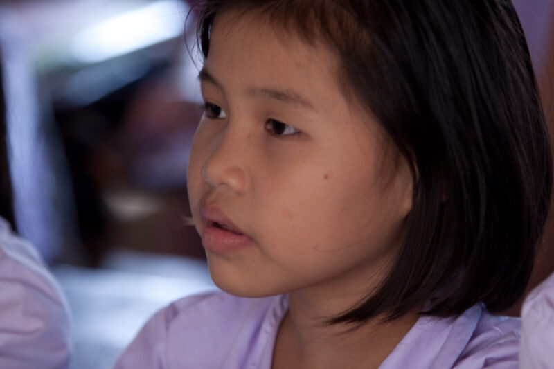 Student in a Refugee Camp — Karen people from Myanmar (Burma) have spent years in in refugee camps along the Thai/Burma border, to avoid violence from the mi...