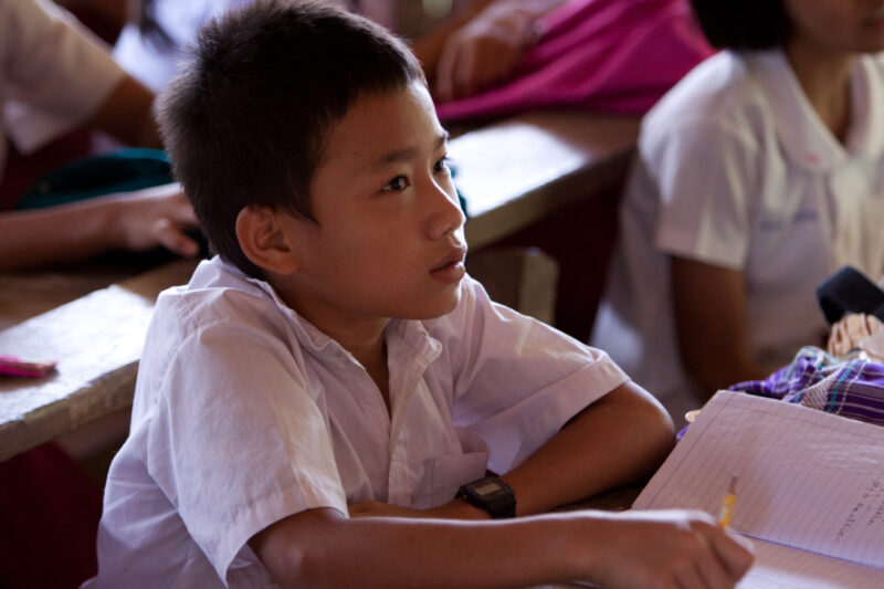 Student in a Refugee Camp — Karen people from Myanmar (Burma) have spent years in in refugee camps along the Thai/Burma border, to avoid violence from the mi...