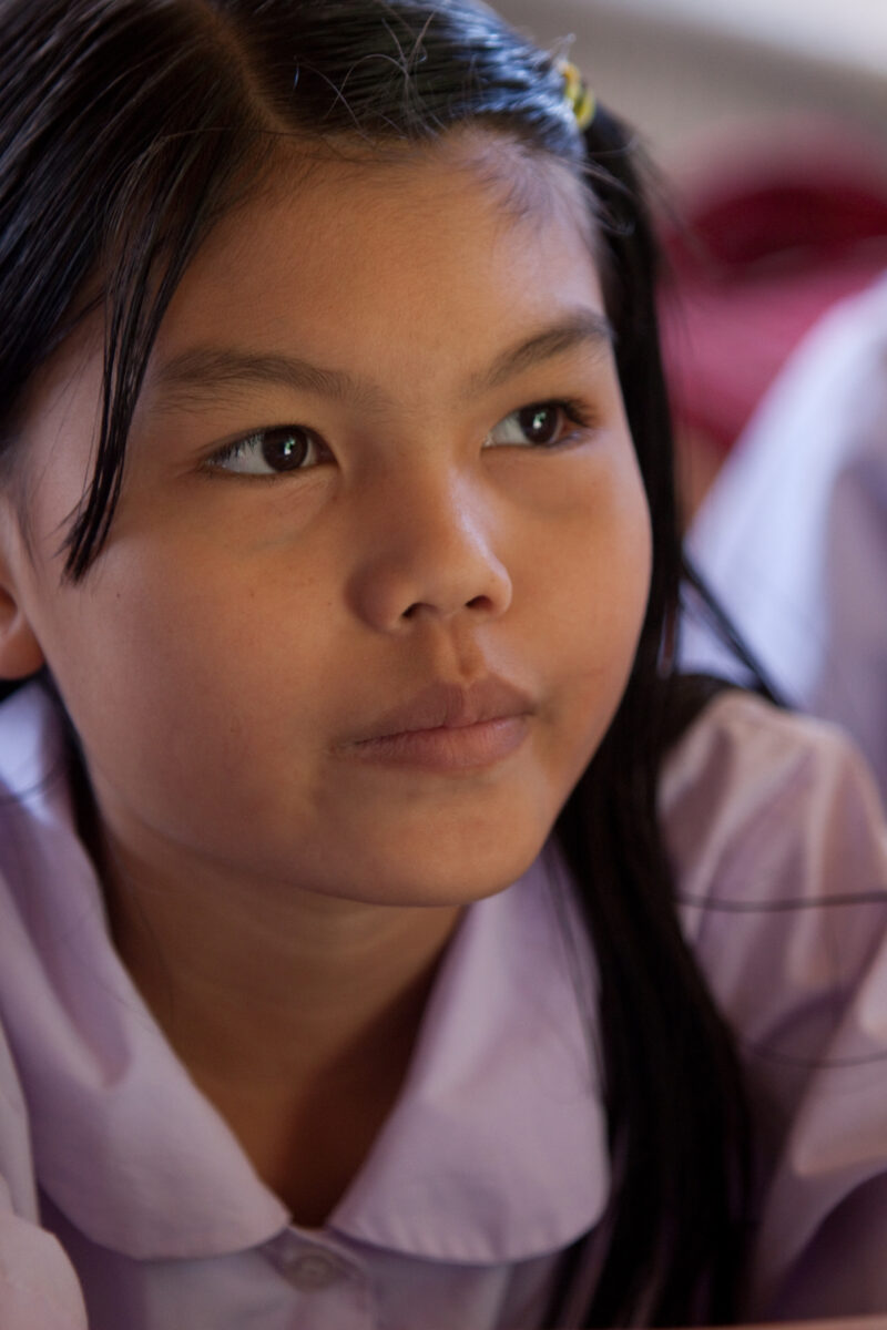 Student in a Refugee Camp — Karen people from Myanmar (Burma) have spent years in in refugee camps along the Thai/Burma border, to avoid violence from the mi...