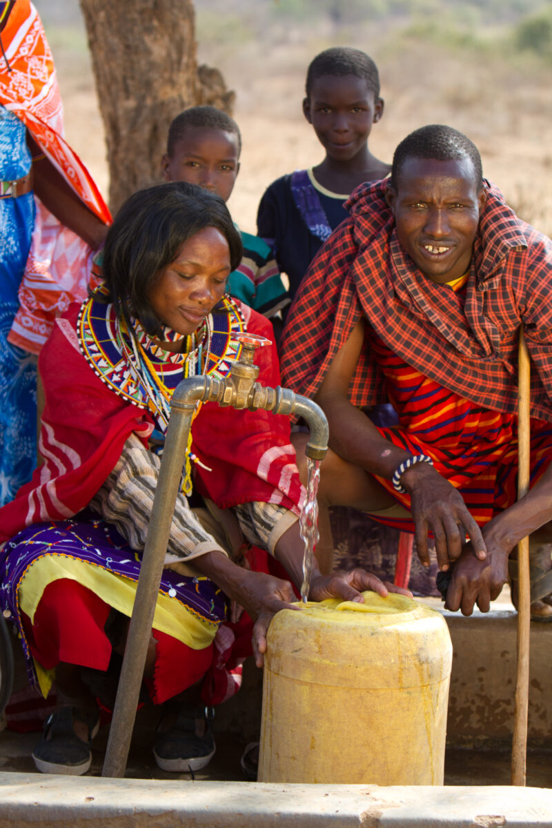 Collecting Water — Maasai collect water from a borehole tap in a dry region of Kenya Africa — Kenya, Water, collecting water, Africa, Maasai