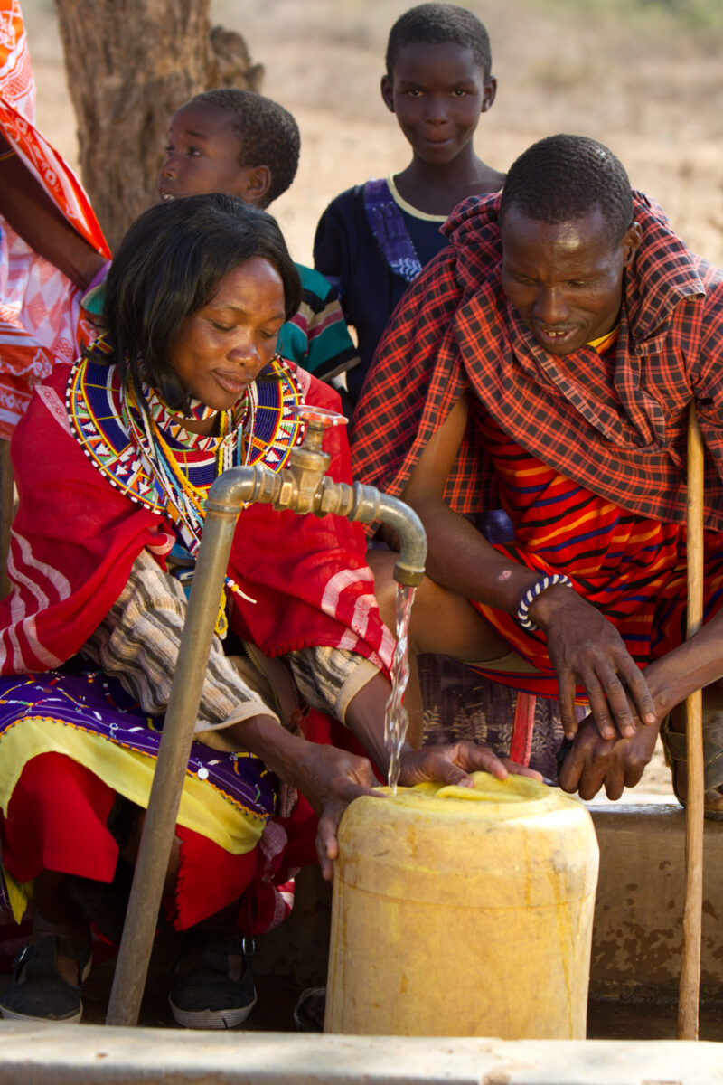 Collecting Water — Maasai collect water from a borehole tap in a dry region of Kenya Africa — Kenya, Water, collecting water, Africa, Maasai