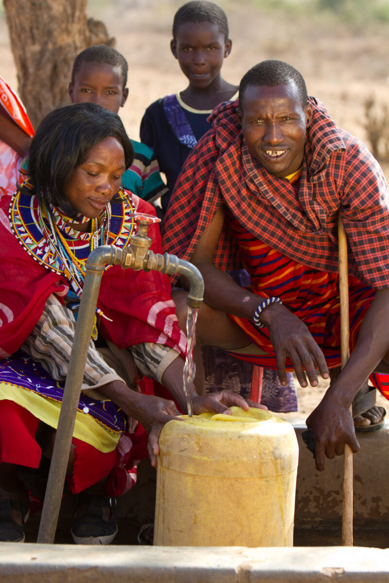Collecting Water — Maasai collect water from a borehole tap in a dry region of Kenya Africa — Kenya, Water, collecting water, Africa, Maasai