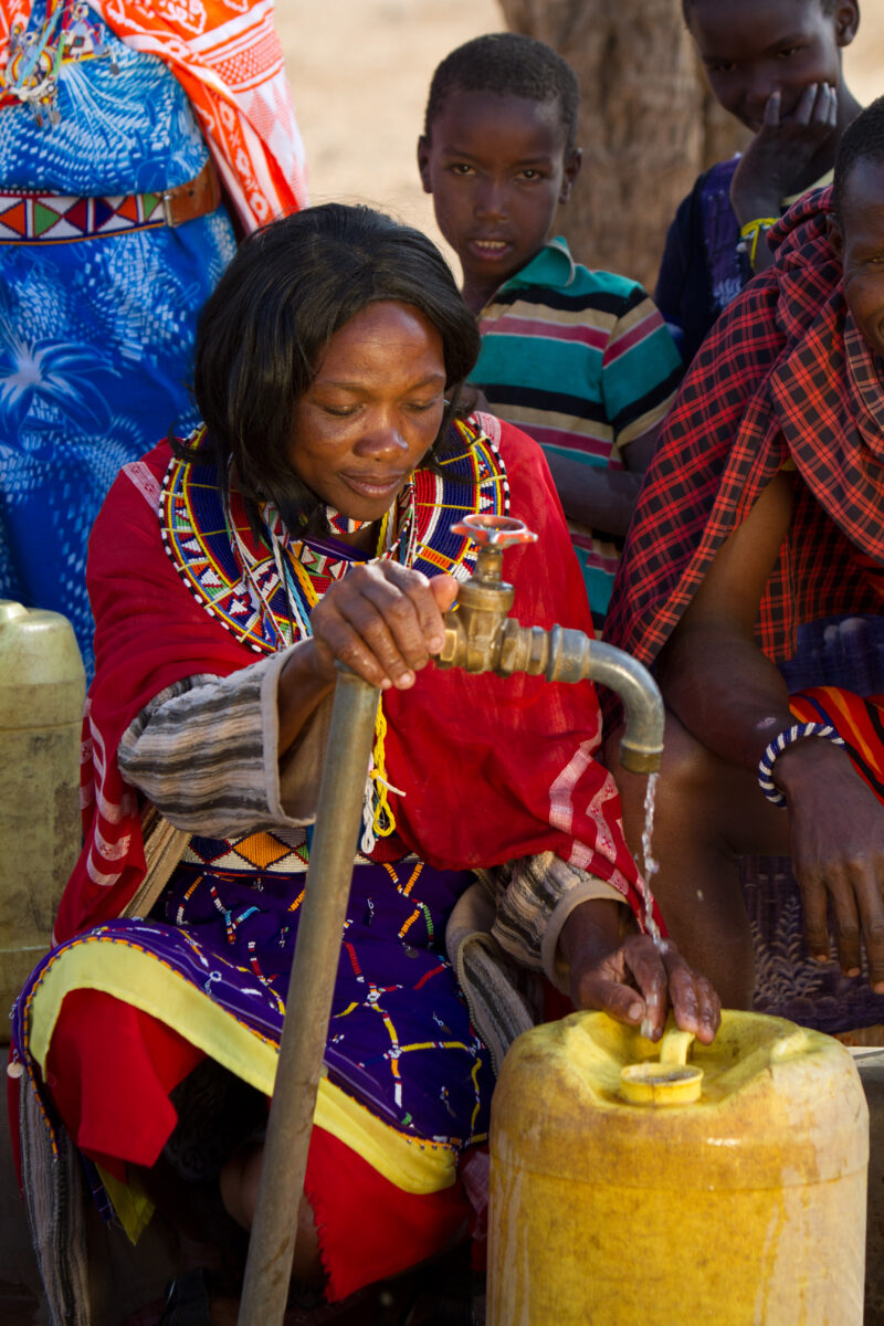 Collecting Water — Maasai collect water from a borehole tap in a dry region of Kenya Africa — Kenya, Water, collecting water, Africa, Maasai