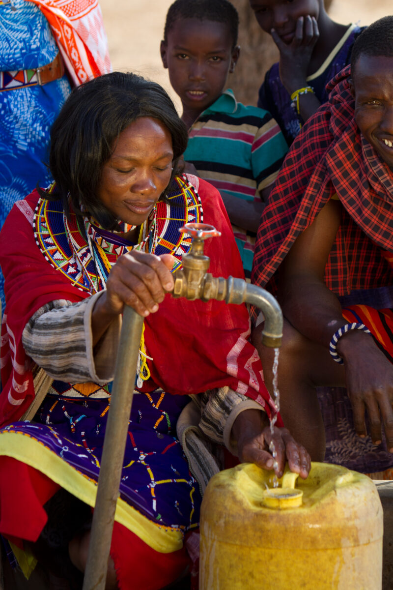 Collecting Water — Maasai collect water from a borehole tap in a dry region of Kenya Africa — Kenya, Water, collecting water, Africa, Maasai