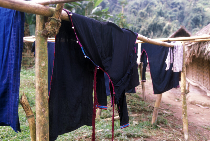 Ethnic Dress Drying — Clotes of Ethnic people dry on bamboo pole — Laos, Southeast Asia, laundry, clothes, wash