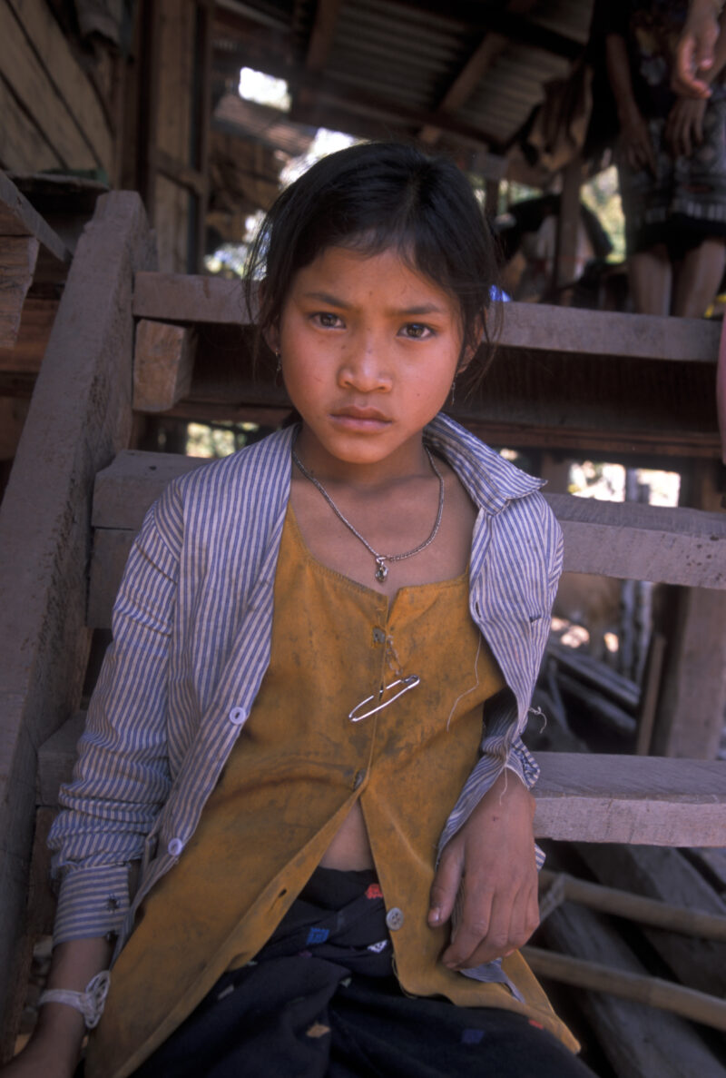 Girl in Laos — Ethnic Minority girl sits on the steps of her home in Northern Laos — Laos, Southeast Asia, girl, girls