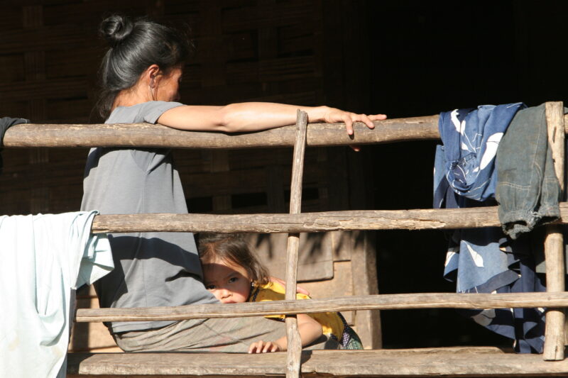 Woman and Baby in Laos — Woman and her child at their home in Northern Laos — Laos, Southeast Asia, woman, Women, child