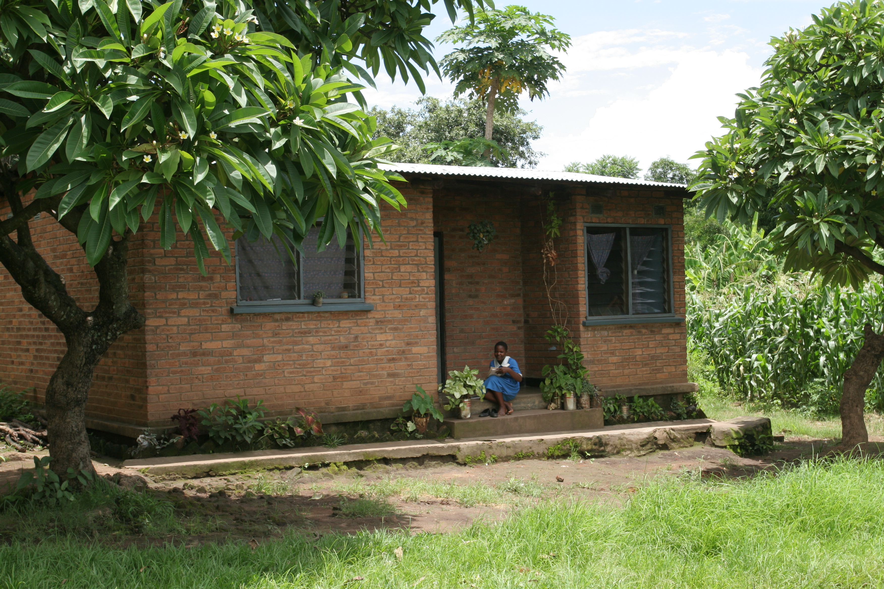 Girl by House in Malawi