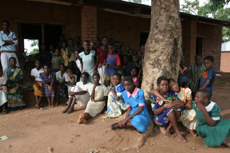 Children in Malawi — Children gather to receive health training from ADRA outside their school in Malawi Africa. — Malawi, Africa, children, students, health...