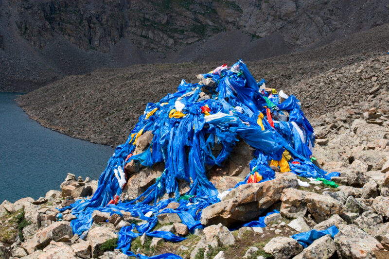 Mongolian Cerimonial Cairn — Typical sight on the tops of hills or important crossroads in the steppes of Mongolia is a cairn that people cover with a blue c...