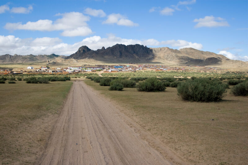 Road in Mongolia — Road leading into a rural village in Mongolia — Mongolia, road, roads, steps, village
