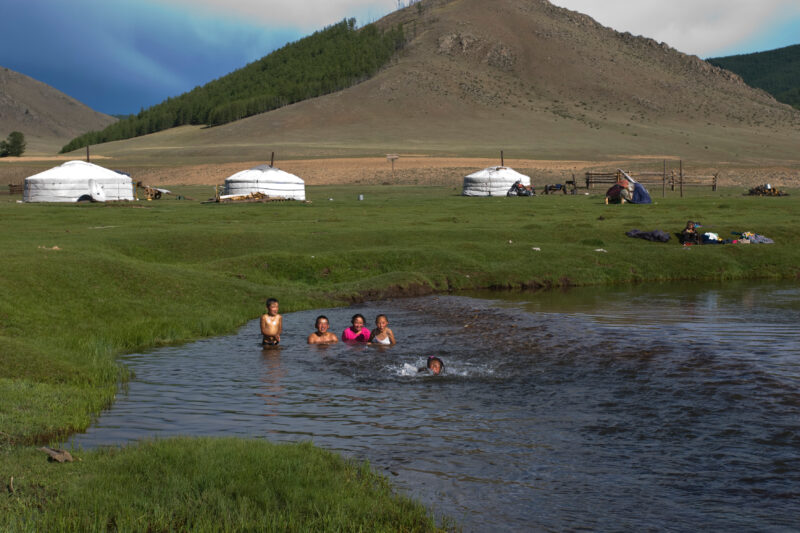 Swiming in the River — Children swim in the mountain fed river that flows by their gers on the Steppes of Mongolia — Mongolia, Steps, steppes, children, river
