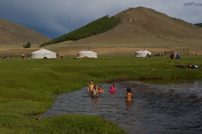 Swiming in the River — Children swim in the mountain fed river that flows by their gers on the Steppes of Mongolia — Mongolia, Steps, steppes, children, river