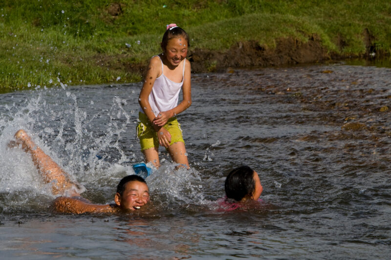 Swiming in the River — Children swim in the mountain fed river that flows by their gers on the Steppes of Mongolia — Mongolia, Steps, steppes, children, river