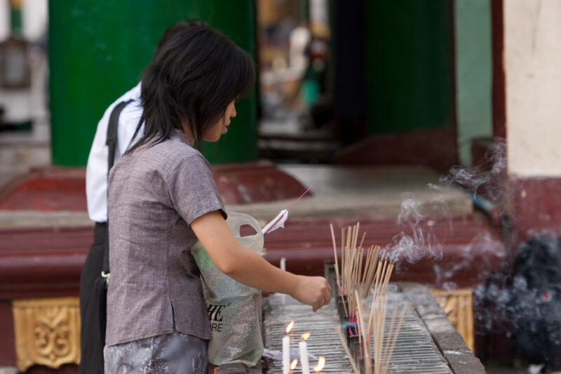 Offering Incense — Buddhist worshipers burn incense at a temple in Yangon — ADRA, Burma, Myanmar, incense, temple