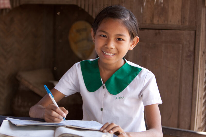 Girl in Myanmar — Girl, just home from school works on her homework — Myanmar, Burma, Faces, girl, girls