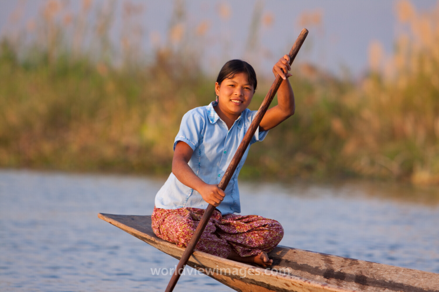 Woman on Canoe in Burma