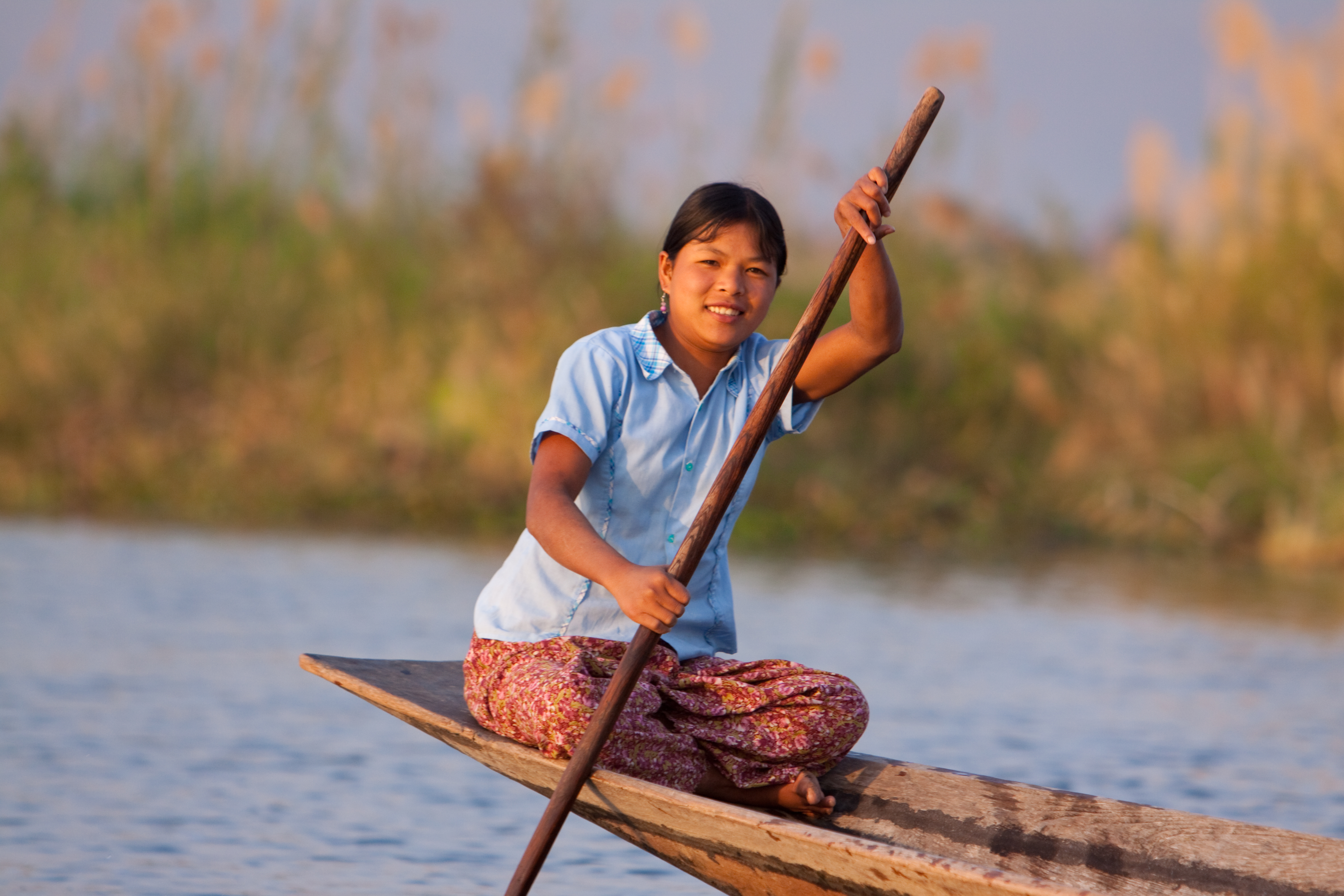 Woman on Canoe in Burma