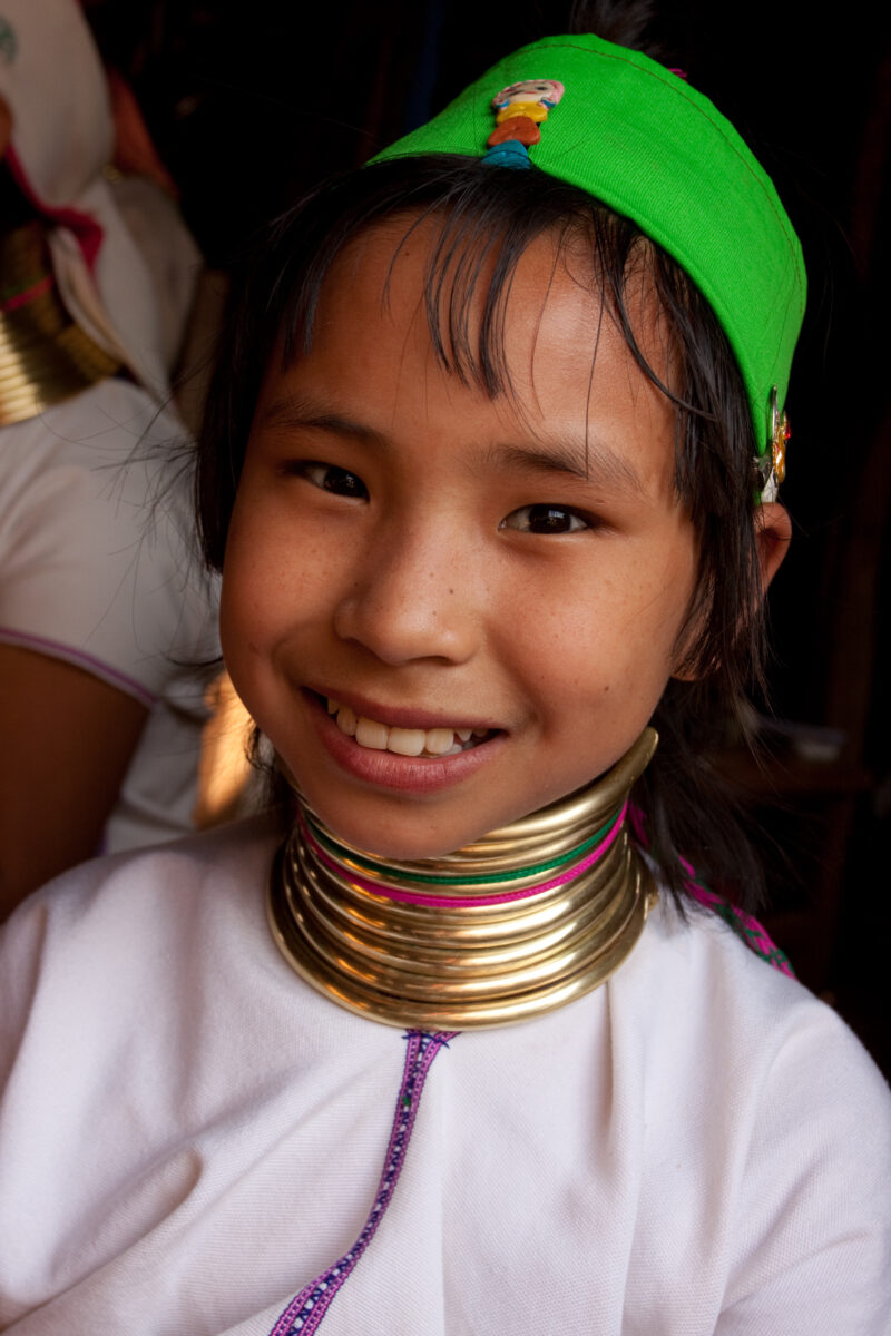 Long Neck Girl in Burma — Girl with brass rings on neck, to give the appearance of a longer neck which is considered desirable in the Padaung culture. — ADRA...