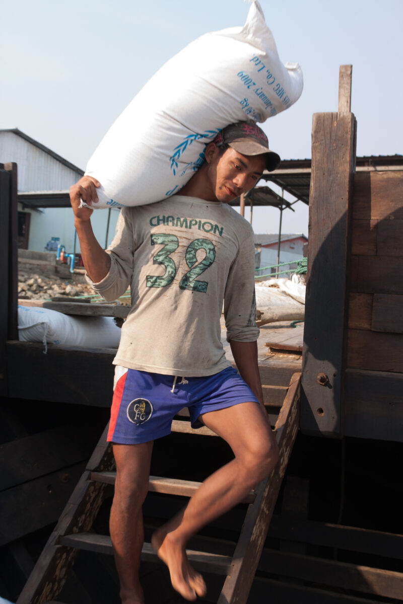 Loading the Boat with Rice in Burma — ADRA, the Adventist Development and Relief Agency, was already working in the Irrawaddy Delta region when Cyclone, Narg...
