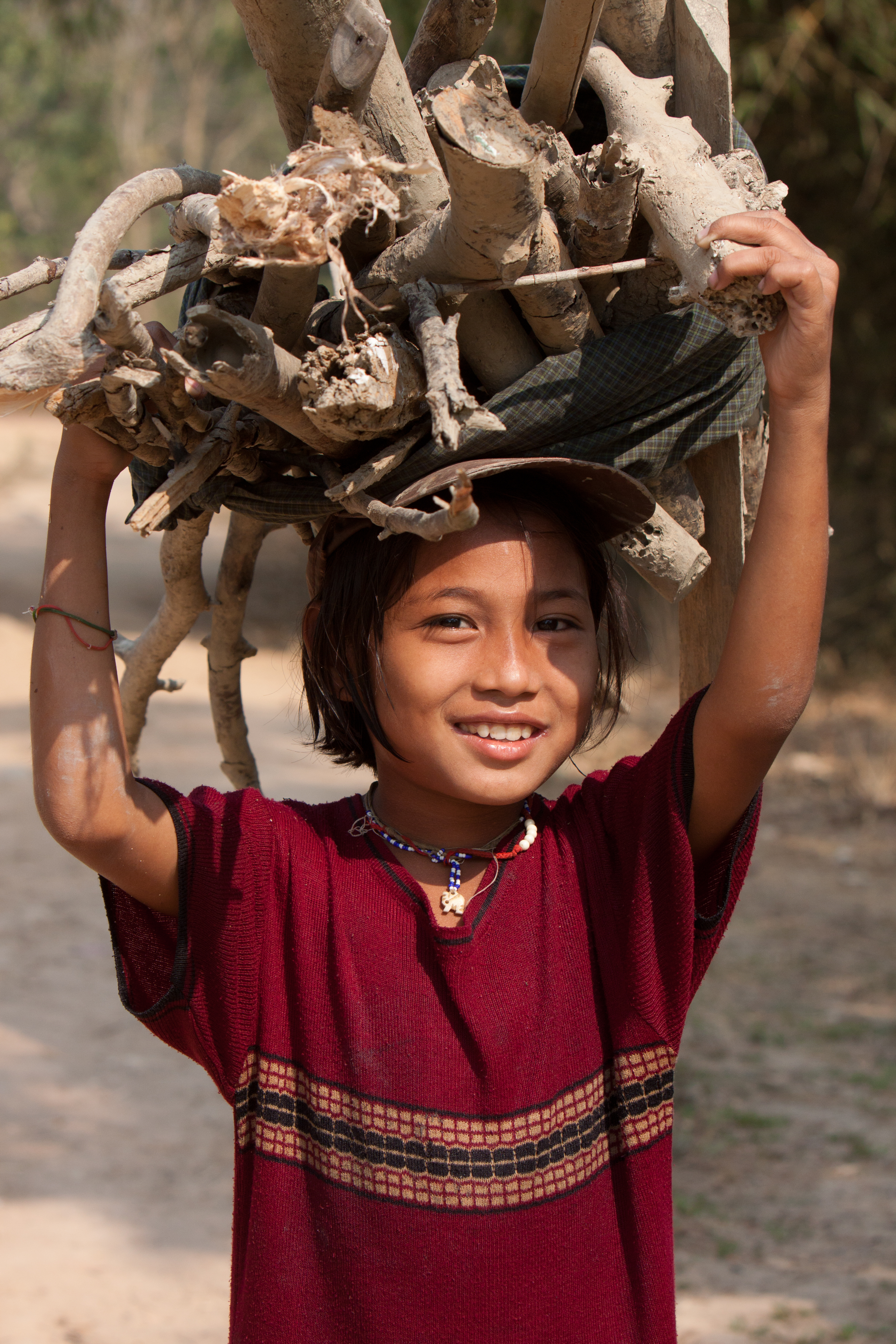 Girl in Burma Collects Firewood