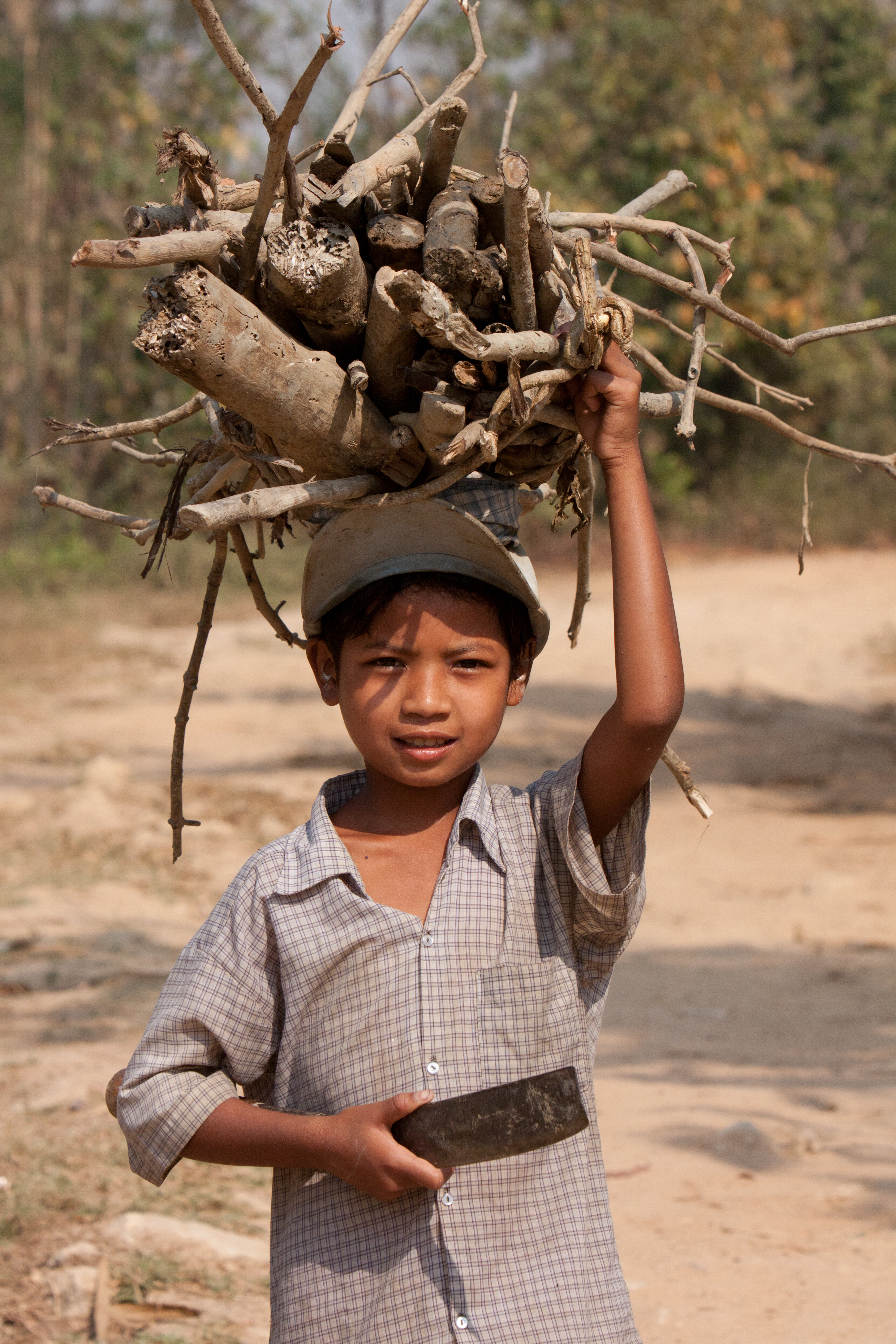 Boy in Burma Collects Firewood