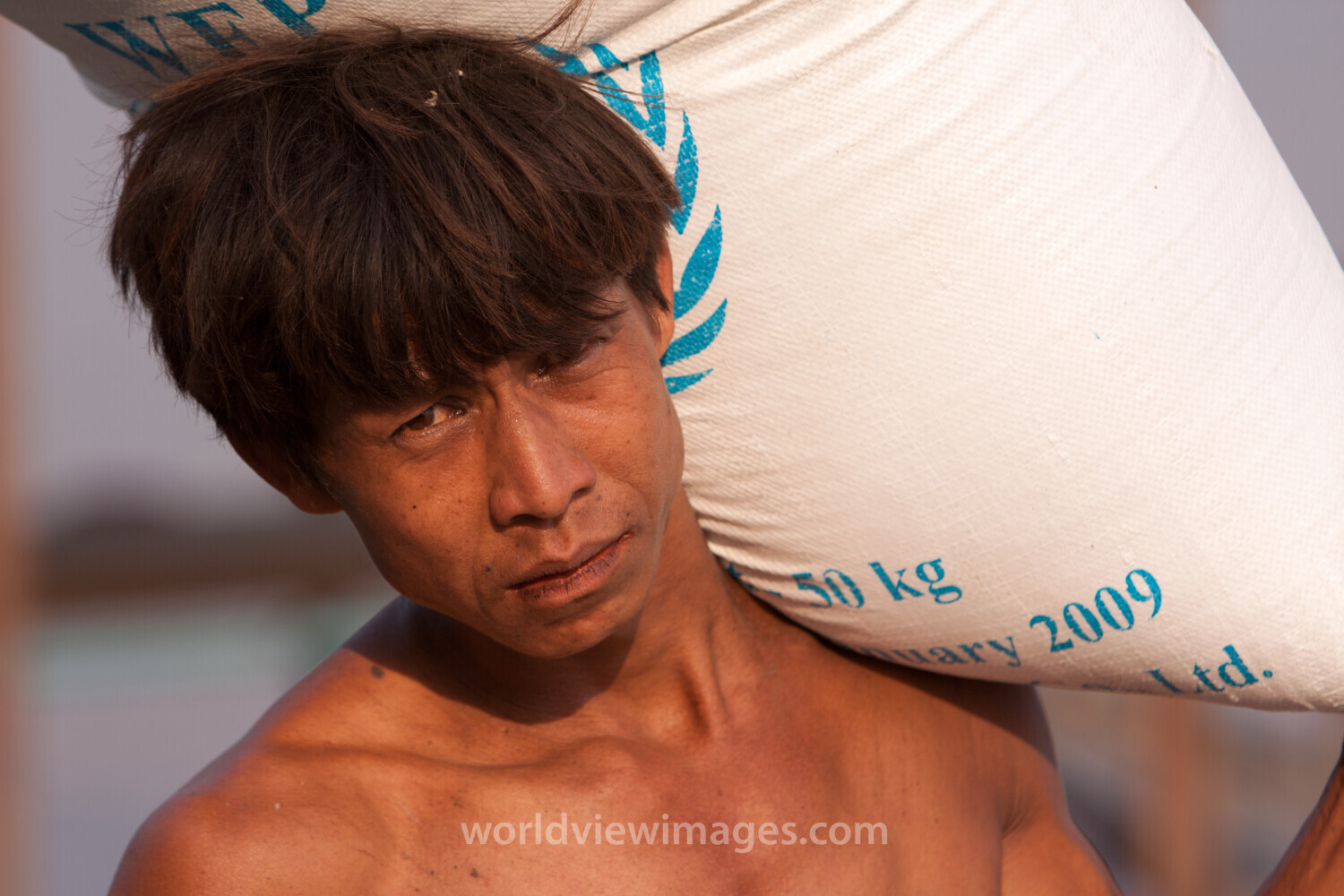 Loading the Boat with Rice in Burma