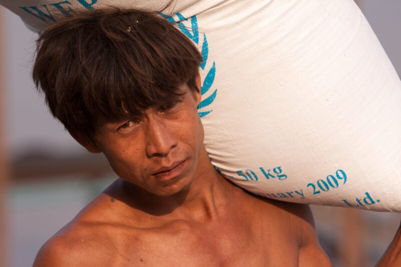 Loading the Boat with Rice in Burma — ADRA, the Adventist Development and Relief Agency, was already working in the Irrawaddy Delta region when Cyclone, Narg...