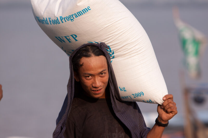 Loading the Boat with Rice in Burma — ADRA, the Adventist Development and Relief Agency, was already working in the Irrawaddy Delta region when Cyclone, Narg...