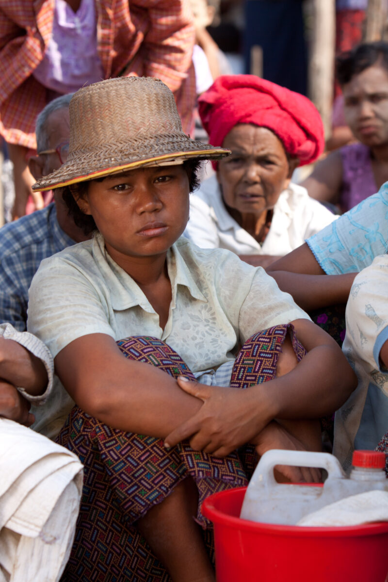 Woman waits for Emergency Food — With all of their crops and fields destroyed by the salt water of cyclone Nargis, villagers of the Irrawaddy Delta region of...
