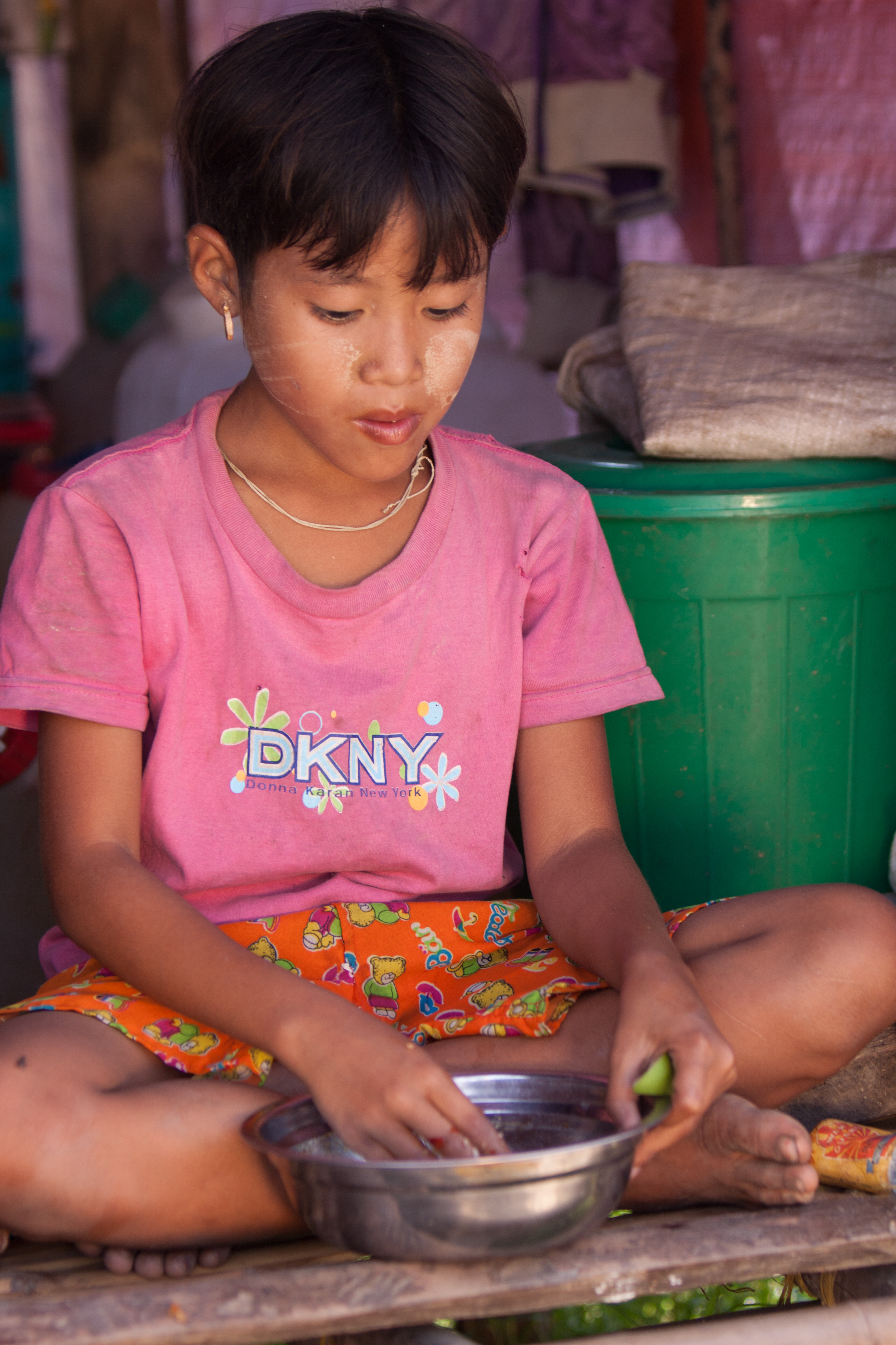 Girl Eats Rations in Burma