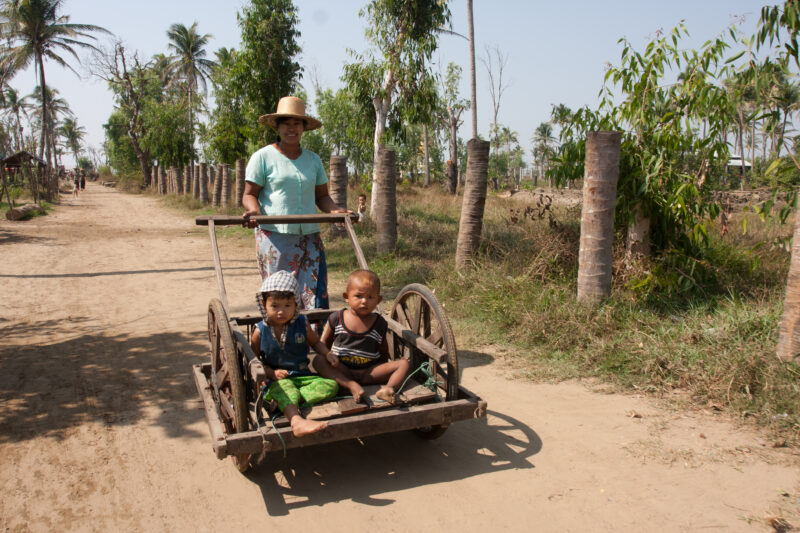 Baby Buggy in Myanmar — Woman takes her babies for a stroll in Burma — Burma, Myanmar, Ayeyarwaddy delta, Irrawaddy Delta, Babies