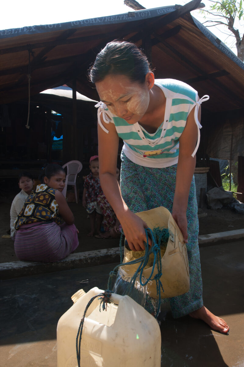 Collecting Water in the Delta — Getting pure water from an ADRA well after Cyclone Nargis conaminated most of the sources of water in the Irrawaddy Delta Reg...