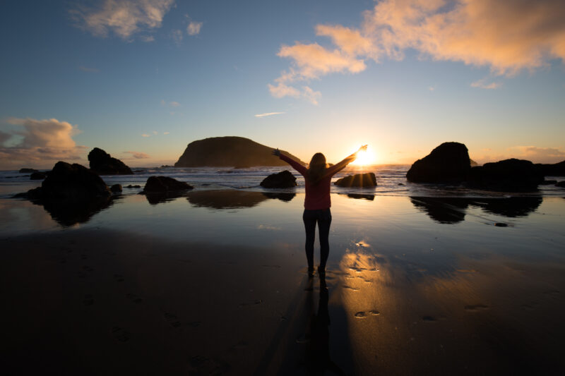 Sunset on the Oregon Coast — Woman gives thanks for the beauty of the Earth — Beach, Coast, Ocean, Oregon, Sea