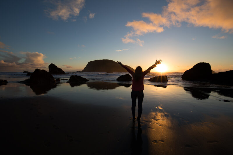Sunset on the Oregon Coast — Woman gives thanks for the beauty of the Earth — Beach, Coast, Ocean, Oregon, Sea