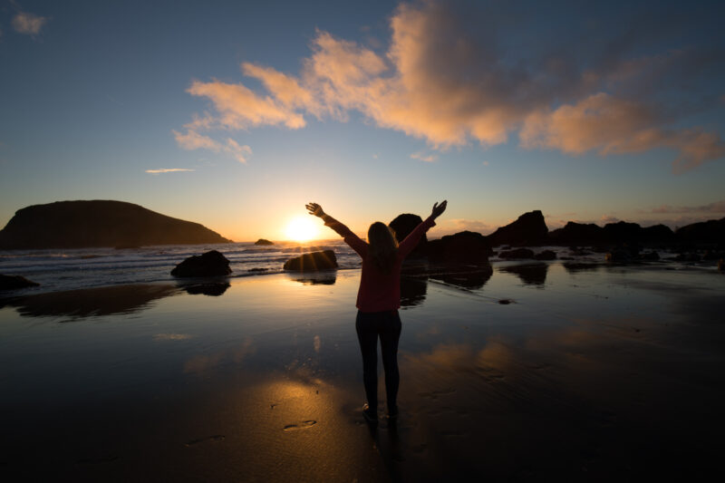 Sunset on the Oregon Coast — Woman gives thanks for the beauty of the Earth — Beach, Coast, Ocean, Oregon, Sea
