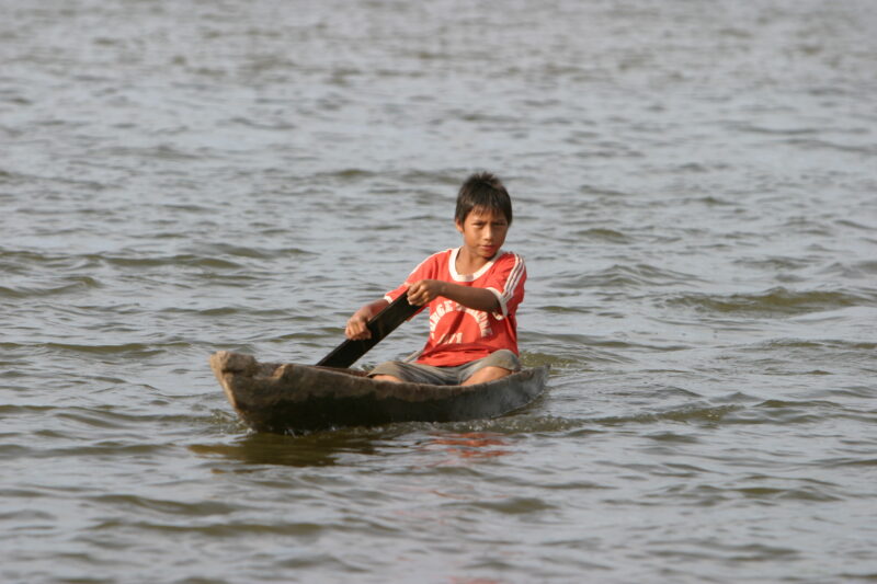 Boy in Dugout Canoe — ADRA, Peru, Poverty, Shipibo Indians, Ucayali River