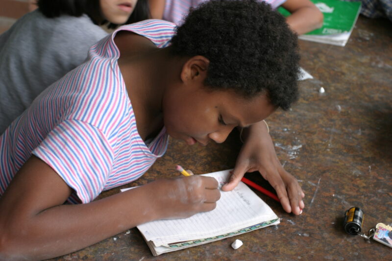 Doing Homework — Children growing up in a shelter — Peru, Poverty, Street Kids, shelter, ababndoned