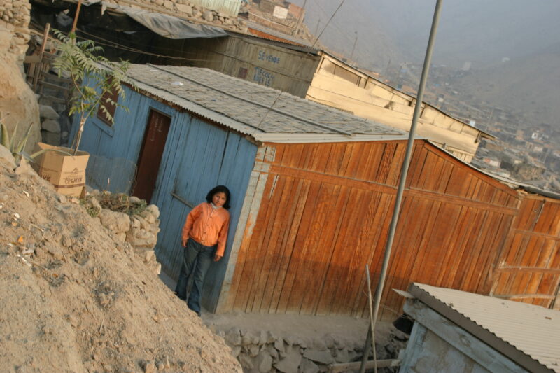 Child of Poverty — Stock Images of poor housing in the shantytown communities on the outskirts of Lima, Peru — Peru, Poverty, Slum, slums, shantytown