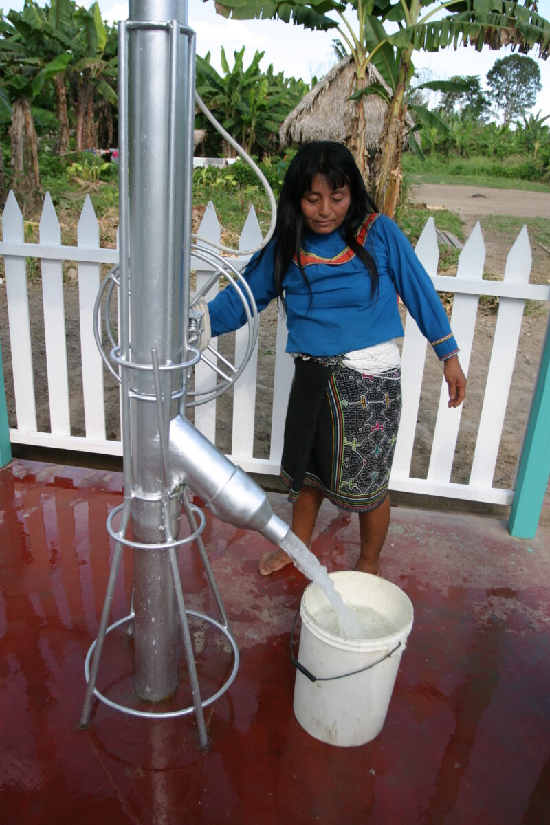 Collecting Water — Shipibo woman gets water from the new water system that ADRA installed in their village. — Peru, ADRA, Poverty, Development, well