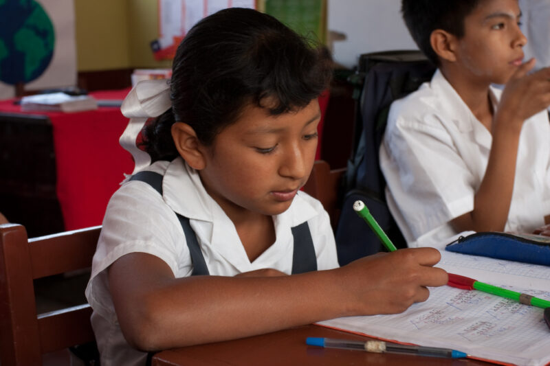 Going to school — Girl from poor community near Lima, attends school, now that her mother is gaining income from her new business that she has started, thank...
