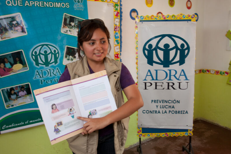 Health Instruction — Women living in a poor community on the outskirts of Lima, attend a weekly workshop for instruction in an ADRA program that brings Adult...