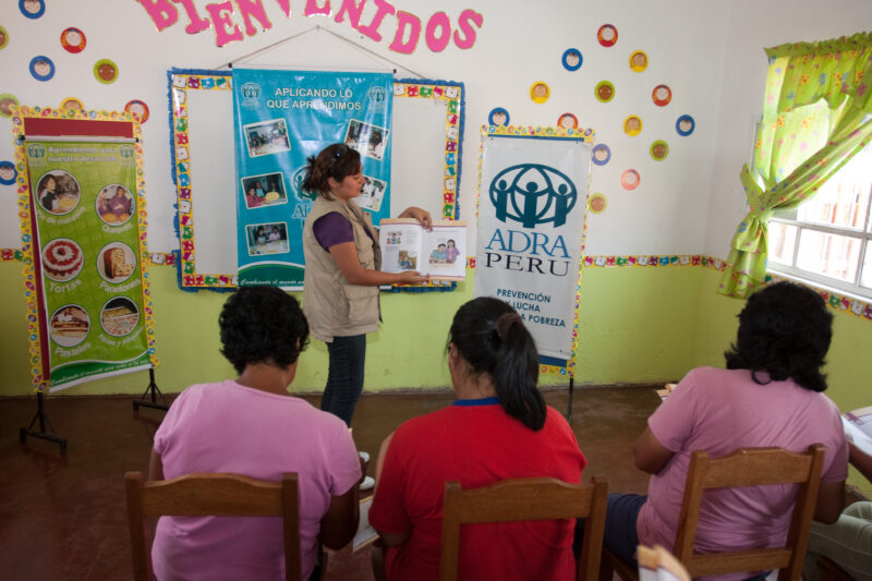 Health Instruction — Women living in a poor community on the outskirts of Lima, attend a weekly workshop for instruction in an ADRA program that brings Adult...