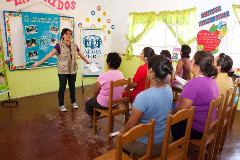 Health Instruction — Women living in a poor community on the outskirts of Lima, learn how to make baked goods, as a way to generate income for their families...