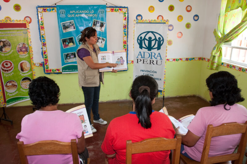 Health Instruction — Women living in a poor community on the outskirts of Lima, attend a weekly workshop for instruction in an ADRA program that brings Adult...