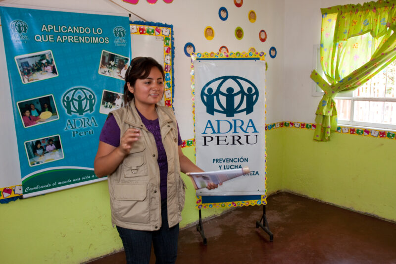 Health Instruction — Women living in a poor community on the outskirts of Lima, attend a weekly workshop for instruction in an ADRA program that brings Adult...